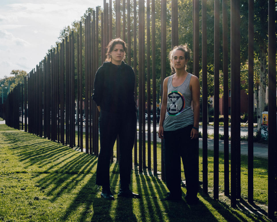 Sara Mardini and Carola Rackete at the Berlin Wall memorial in September. Once divided here by a militarized border, Germany has since 2015 accepted more than 1 million refugees, including Mardini. | Mustafah Abdulaziz for TIME