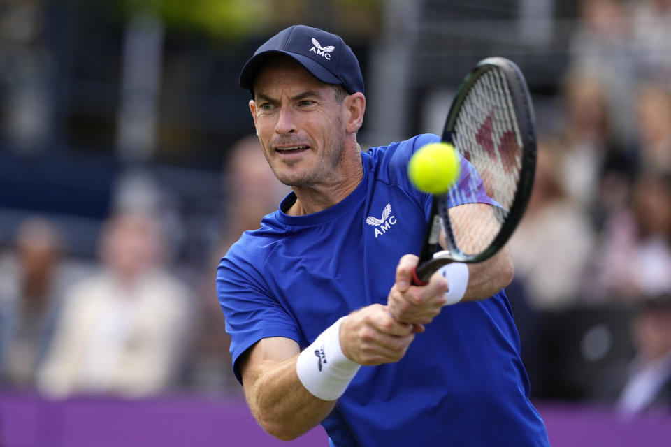 FILE - Andy Murray of Britain plays a return to Jordan Thompson of Australia during their men's singles match on day five of The Queen's Club tennis tournament, in London, Wednesday, June 19, 2024. Two-time Wimbledon champion Andy Murray still had not decided as of Thursday whether he will be able to compete at the grass-court Grand Slam tournament that begins next week and he is likelier to enter doubles than singles if he can play at all after recent surgery to remove a cyst on his spinal cord. (AP Photo/Kirsty Wigglesworth, File)