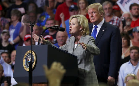 FILE PHOTO: U.S. Senator Cindy Hyde-Smith (R-MS) joins President Donald Trump onstage at a campaign rally in Southaven, Mississippi, U.S. October 2, 2018. REUTERS/Jonathan Ernst/File Photo