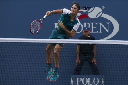 Roger Federer of Switzerland serves the ball to Leonardo Mayer of Argentina in their first round match at the U.S. Open Championships tennis tournament in New York, September 1, 2015. REUTERS/Brendan McDermid Picture Supplied by Action Images