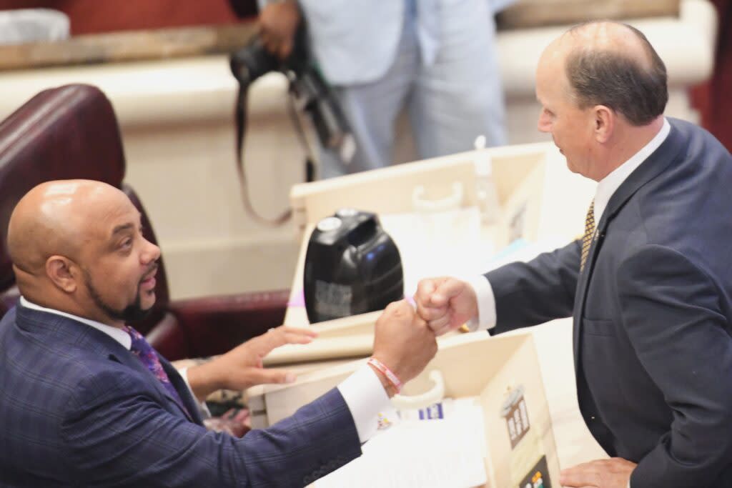 Two men bumping fists