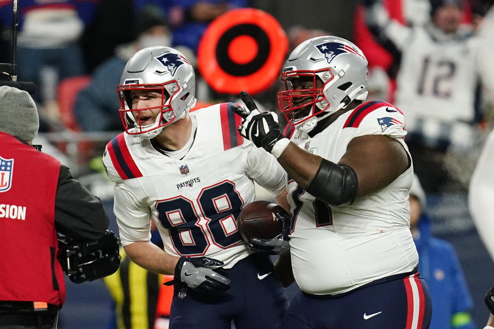 New England Patriots tight end Mike Gesicki (88) celebrates his 11-yard reception for a touchdown with guard Mike Onwenu (71) during the second half of an NFL football game against the Denver Broncos, Sunday, Dec. 24, 2023, in Denver. (AP Photo/Geneva Heffernan)