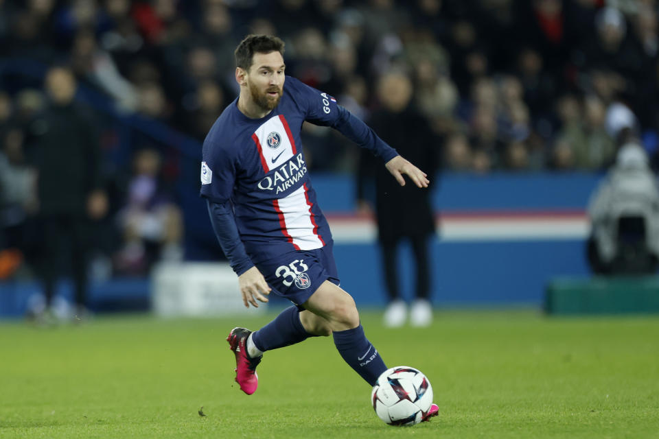 PSG's Lionel Messi runs with the ball during the French League One soccer match between Paris Saint-Germain and Toulouse, at the Parc des Princes, in Paris, France, Saturday, Feb. 4, 2023. (AP Photo/Lewis Joly)