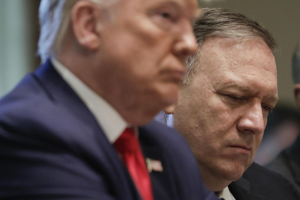 Secretary of State Mike Pompeo, right and President Donald Trump, left, listen during a Cabinet meeting in the Cabinet Room of the White House, Monday, Oct. 21, 2019, in Washington. (AP Photo/Pablo Martinez Monsivais)