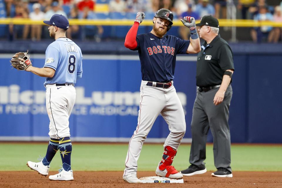 Boston Red Sox's Christian Arroyo, center, celebrates after a double in the fifth inning of a baseball game against the Tampa Bay Rays in St. Petersburg, Fla., Thursday, April 13, 2023. (Ivy Ceballo/Tampa Bay Times via AP)