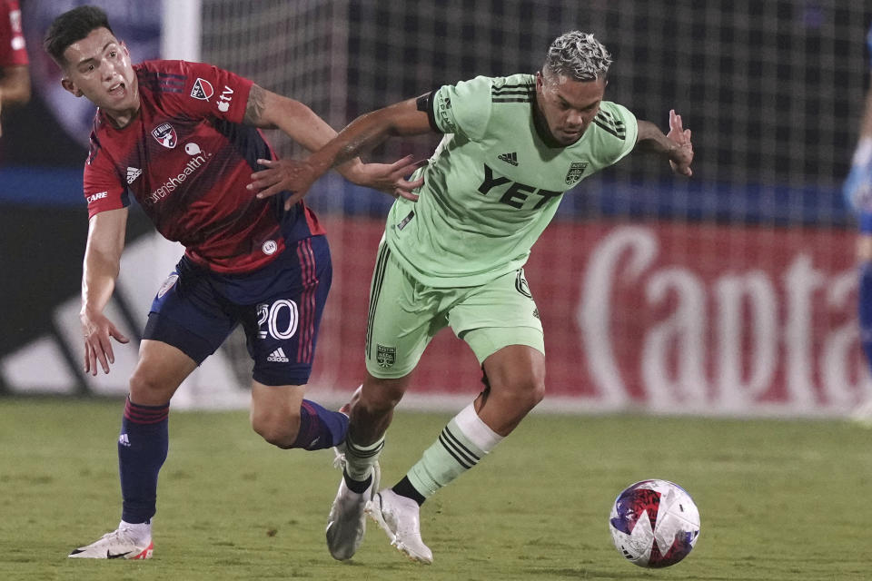 Austin FC midfielder Daniel Pereira chases the ball next to FC Dallas forward Alan Velasco (20) during the first half of an MLS soccer match Saturday, Aug. 26, 2023, in Frisco, Texas. (AP Photo/LM Otero)