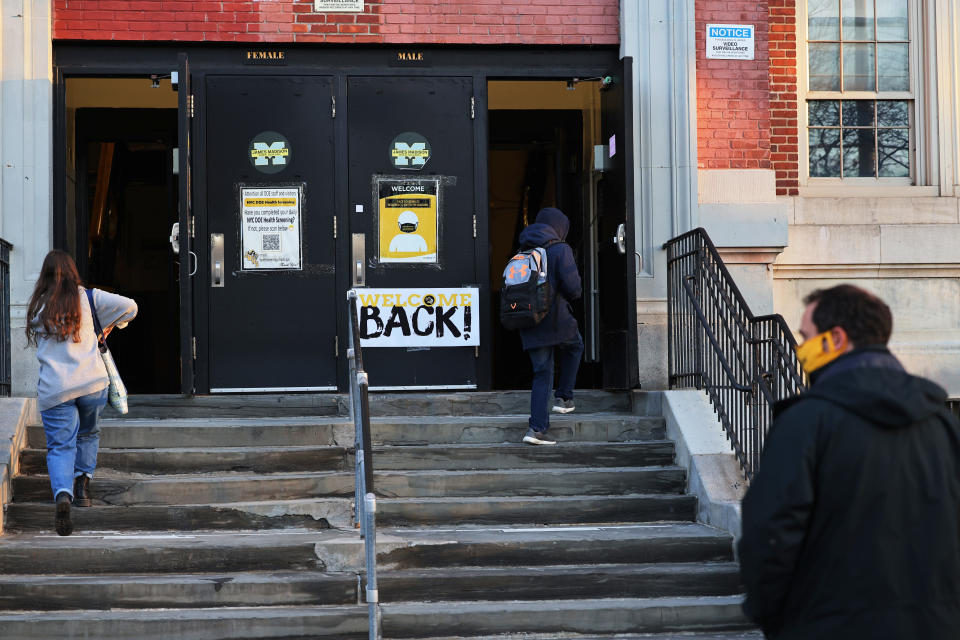 Students prepare to enter James Madison High School on March 22, 2021 in the Madison neighborhood of the Brooklyn borough in New York City. (Michael M. Santiago/Getty Images)