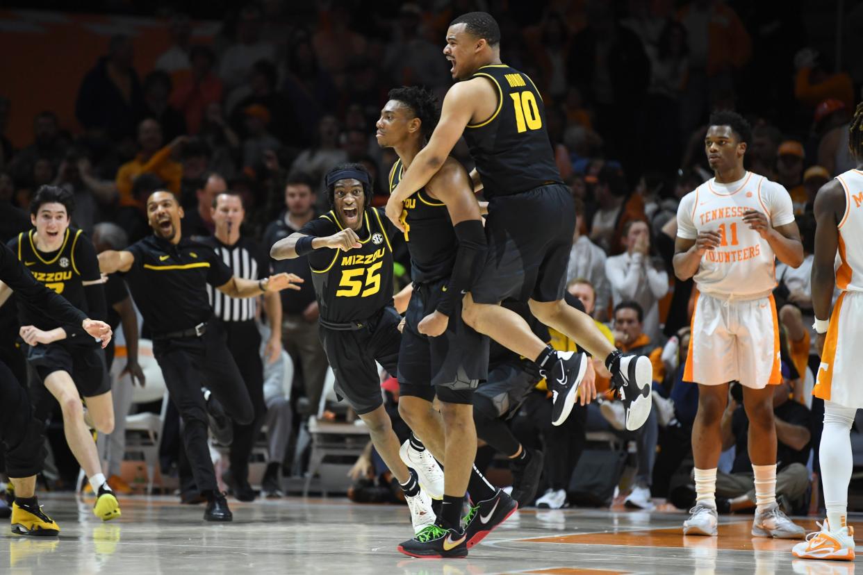 Missouri point guard Nick Honor (10) celebrates Missouri guard DeAndre Gholston (4) game winning buzzer beater during an NCAA college basketball game between the Missouri Tigers and the Tennessee Volunteers in Thompson-Boling Arena in Knoxville, Saturday Feb. 11, 2023. Missouri defeated Tennessee in the final second of the game, 86-85.