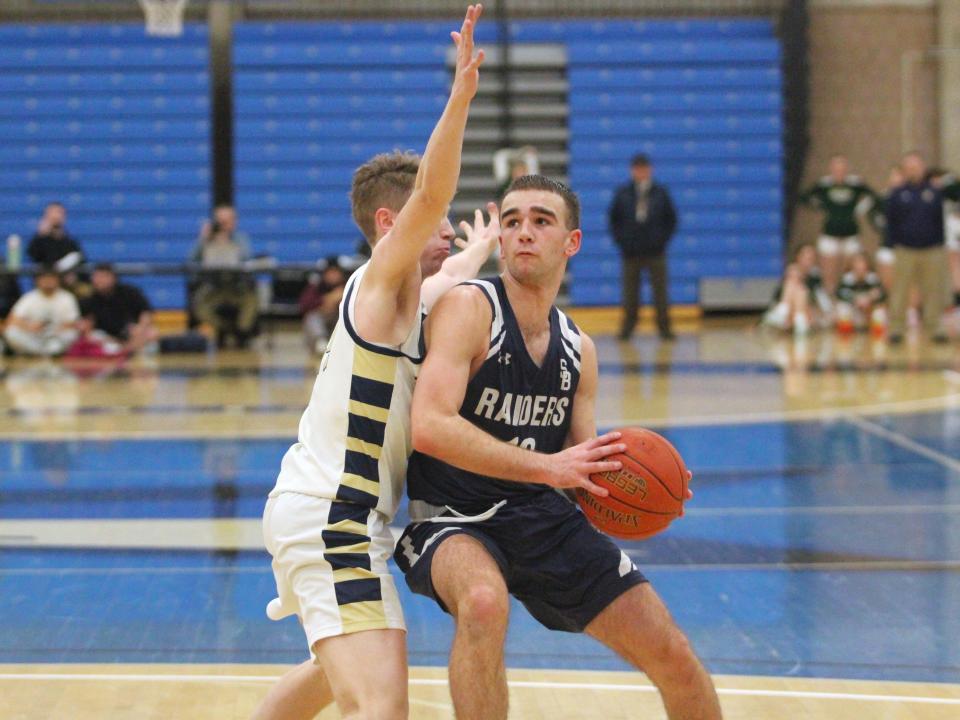 Somerset Berkley's Mason Medeiros looks to get past Malden Catholic's Matthew Gaffney during a Division 2 Final Four game.