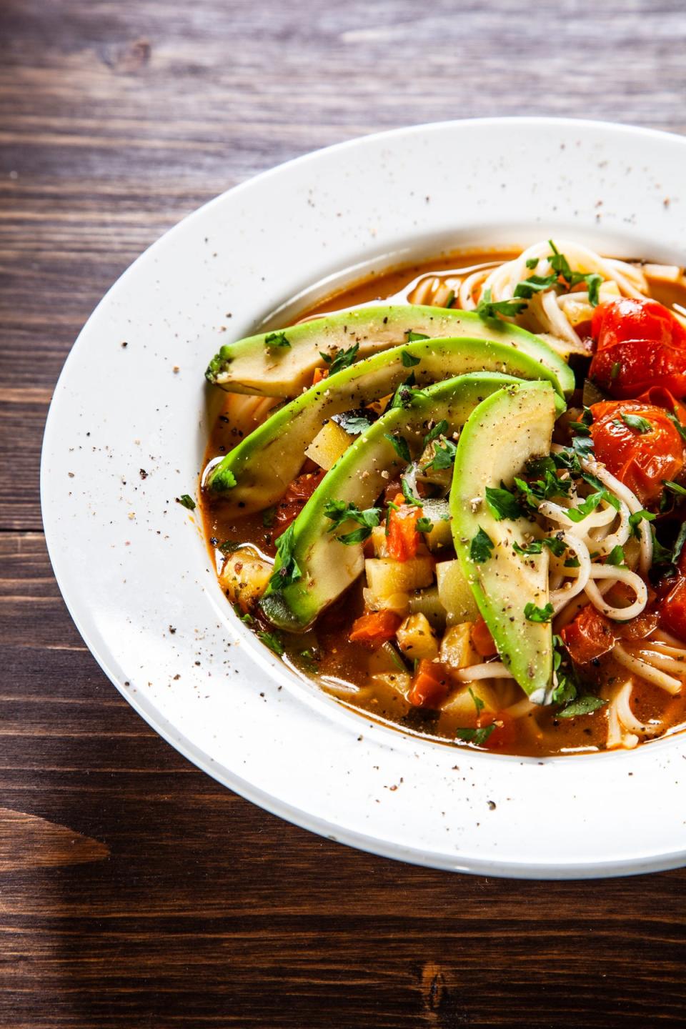 Halved cherry tomatoes provide a strong flavour foundation for this cold noodle dish (Getty/iStock)