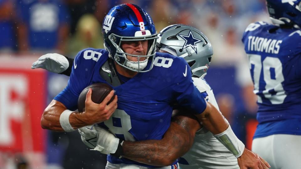 Sep 10, 2023; East Rutherford, New Jersey, USA; New York Giants quarterback Daniel Jones (8) is sacked by Dallas Cowboys linebacker Micah Parsons (11) during the first half at MetLife Stadium.
