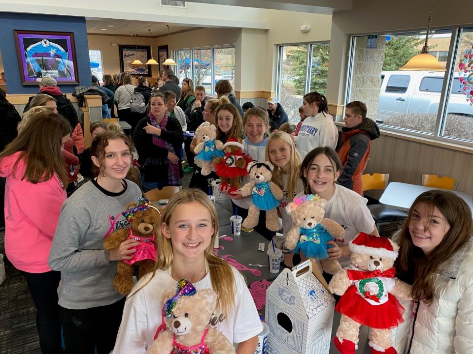 Waukesha Xtreme Dance Team handed out Build-A-Bears to girls on the team Wednesday at a benefit at a Culver's in Waukesha. The bears had been donated to the dance team, which was one of the groups most heavily impacted when a man in a red Ford Escape barreled down the Waukesha Christmas parade, killing at least six and injuring more than 60.