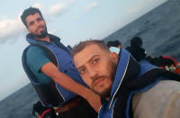 Palestinian Jihad Michlawi, right, takes a selfie with Syrian Mohammad Homsi, who drowned after the boat sunk, while on board an overcrowded migrant boat in the Mediterranean Sea, Lebanon, early morning Wednesday, Sept. 21, 2022. Michlawi is one of dozens of survivors from a migrant boat that left Tripoli, Lebanon heading towards Italy carrying over 100 Lebanese, Syrians, and Palestinians, that capsized near the Syrian coastal city of Tartus. (Courtesy of Jihad Michlawi via AP)