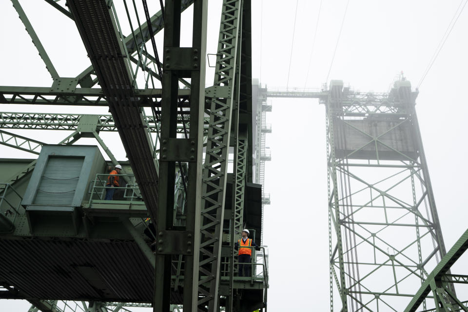 U.S. Transportation Secretary Pete Buttigieg tours the century-old Interstate 5 bridge that spans the Columbia River and connects Portland, Ore., with southwest Washington state on Tuesday, Feb. 13, 2024. The bridge is set to be replaced as part of a multibillion-dollar project supported by federal funding. (AP Photo/Jenny Kane)