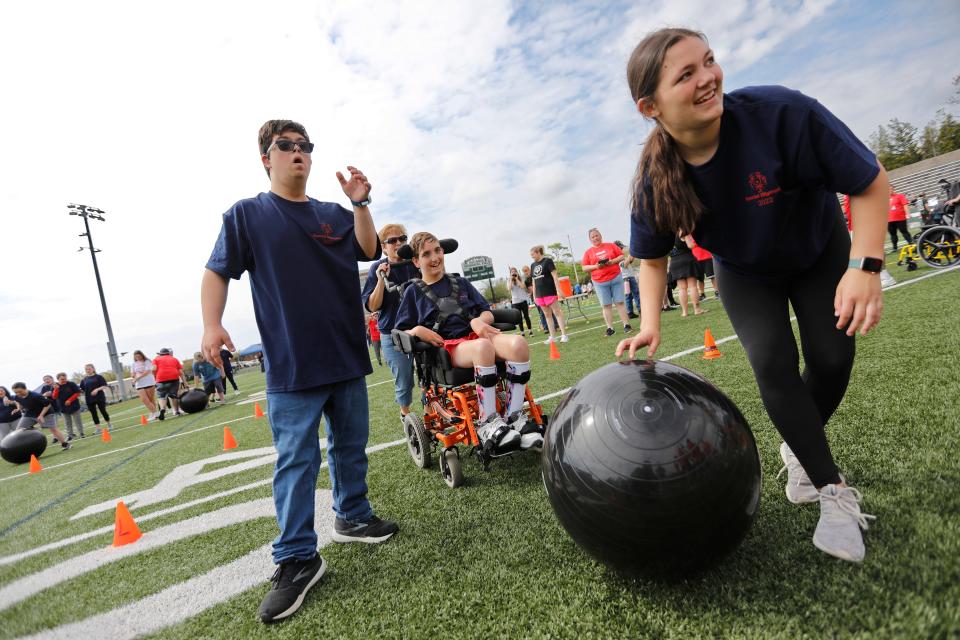 Students from the Freetown-Lakeville Regional School District participate in a relay race at the Special Olympics held at Memorial Stadium in Dartmouth on Friday, representing one of several area districts to take part in the day.