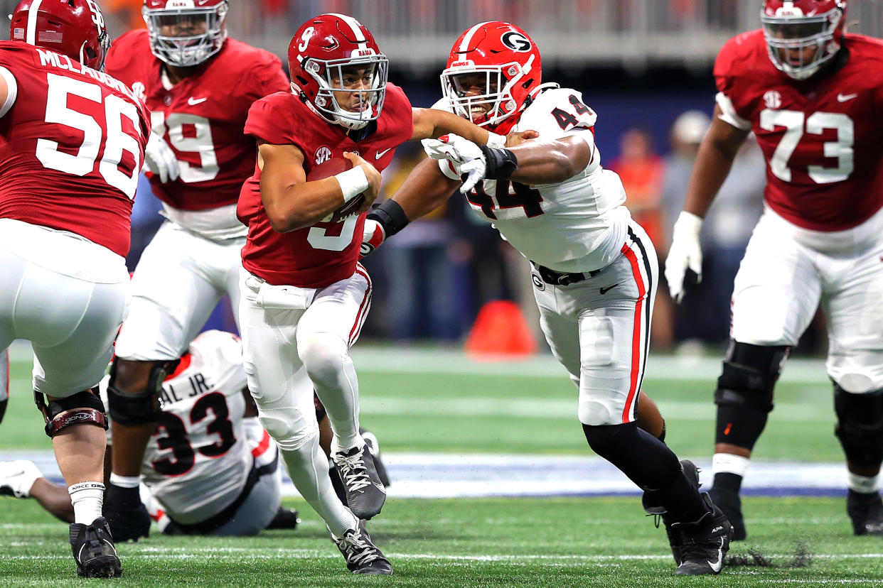 Alabama QB Bryce Young runs with the ball in the second quarter of the Crimson Tide's SEC title game win over Georgia on Dec. 4. (Kevin C. Cox/Getty Images)