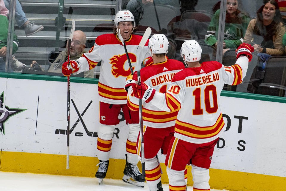 Calgary Flames center Blake Coleman (20) smiles after scoring during the third period of an NHL hockey game against the Dallas Stars, Friday, Nov. 24, 2023, in Dallas. (AP Photo/Emil T. Lippe)