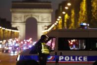 Police secure the Champs Elysees Avenue after one policeman was killed and another wounded in a shooting incident in Paris, France, April 20, 2017. REUTERS/Christian Hartmann