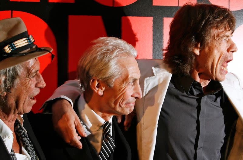 Rolling Stones band members Keith Richards (L), Mick Jagger (R), and Charlie Watts arrive at the premiere of the documentary film "Shine A Light", directed by Martin Scorsese about the Rolling Stones, in New York