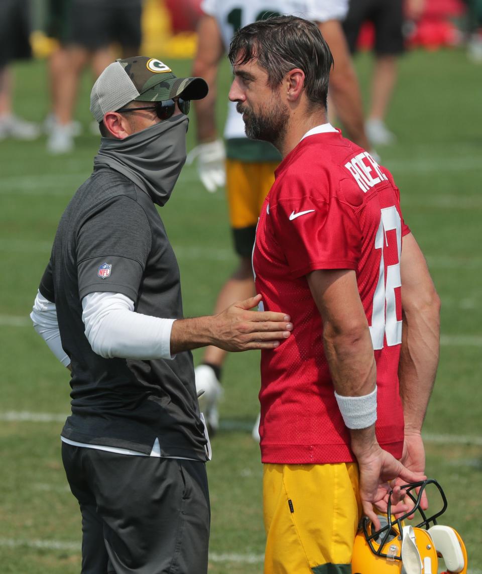 Green Bay Packers head coach Matt LaFleur, left, talks with quarterback Aaron Rodgers (12) Monday, August 24, 2020 during the team's training camp at Ray Nitschke Field in Ashwaubenon.