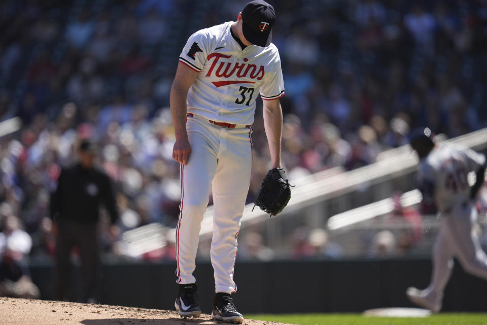 Minnesota Twins pitcher Louie Varland (37) reacts after a two-run home run by Detroit Tigers' Buddy Kennedy during the third inning of a baseball game Sunday, April 21, 2024, in Minneapolis. (AP Photo/Abbie Parr)