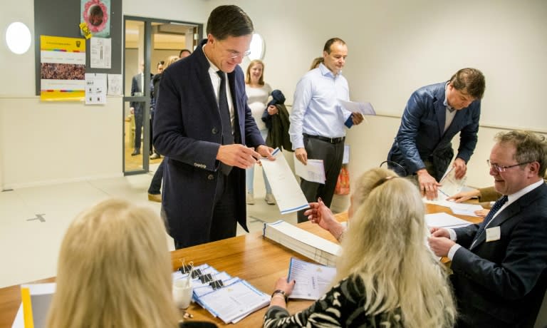 Dutch Prime Minister Mark Rutte casts his vote in local elections at a polling station in The Hague on Wednesday