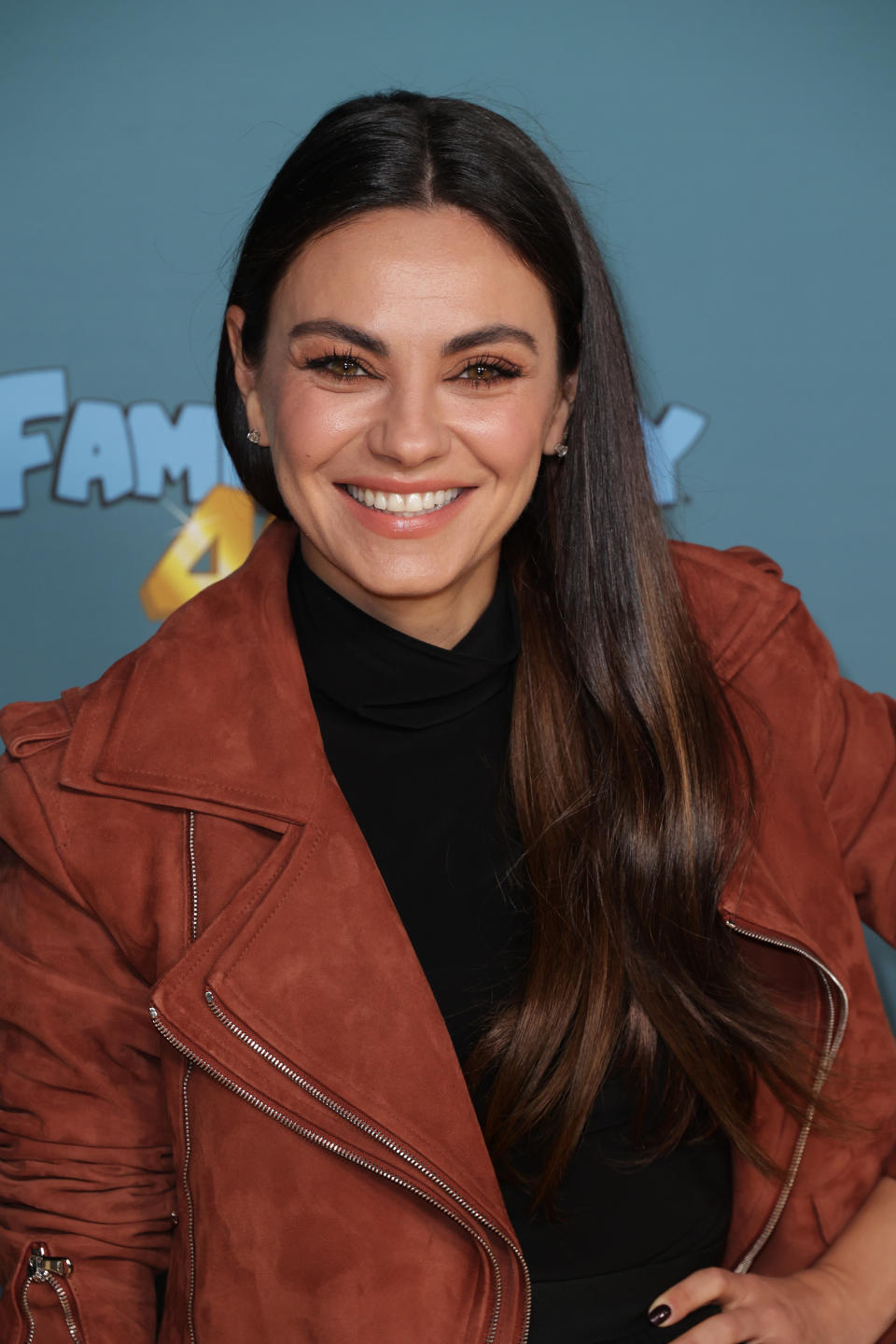 closeup of Mila Kunis smiling