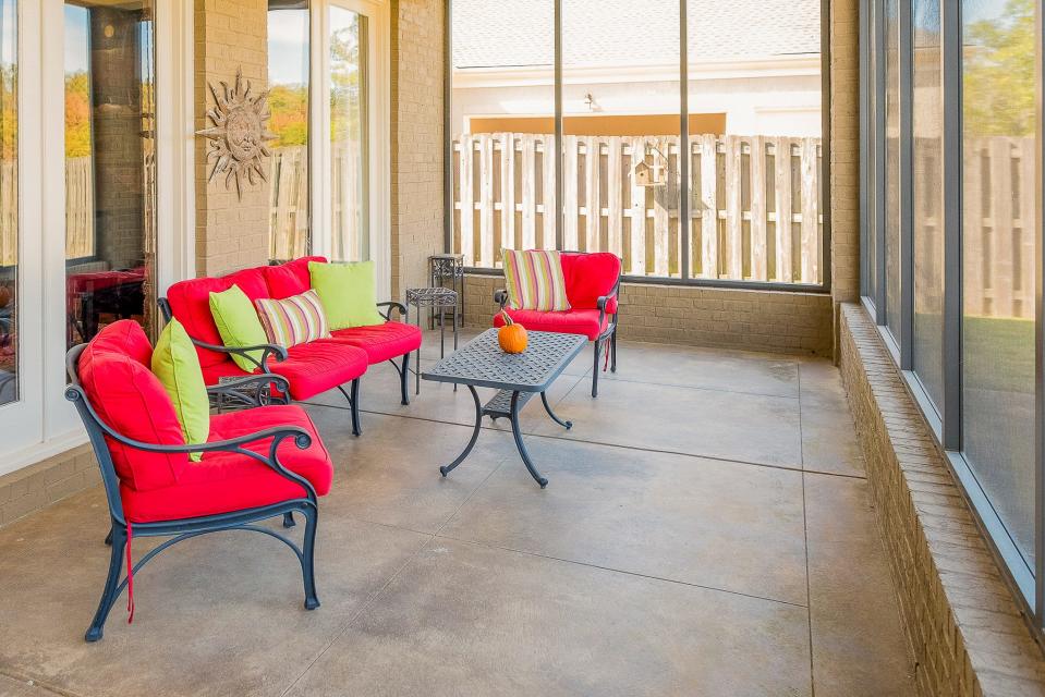 An extra-large screen porch provides a comfortable place to relax.