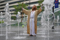 <p>A man dressed a Jesus stands in a water fountain at City Hall on day four of the Democratic National Convention (DNC) on July 28, 2016 in Philadelphia, Pa. (Photo: Jeff J Mitchell/Getty Images)</p><p><br></p>