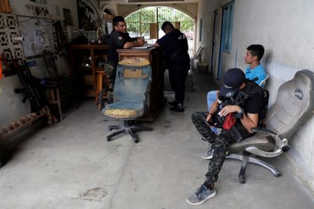 Vigilantes are pictured at the command headquarters in the municipality of Coahuayana