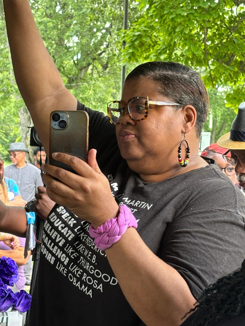 K.J. Moore of Springfield holds up a fist in support of Sonya Massey at a rally at Comer Cox Park on July 28, 2024. The gathering drew about 350 people for Massey, who was fatally shot in her home by a Sangamon County Sheriff's deputy on July 6, sparking national outrage.