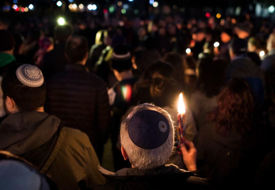 Members and supporters of the Jewish community attend a candlelight vigil in remembrance of those who died earlier in the day during a shooting at the Tree of Life Synagogue in the Squirrel Hill neighborhood of Pittsburgh on October 27, 2018. (Photo by ANDREW CABALLERO-REYNOLDS/AFP via Getty Images)