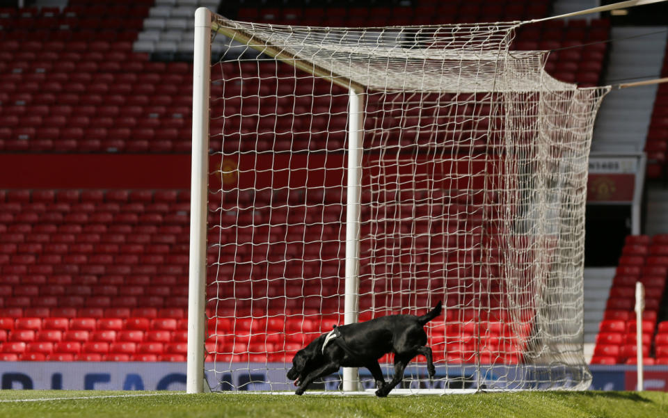 Police use sniffer dogs as fans are evacuated from Old Trafford stadium before the Barclays Premier League match between Manchester United and AFC Bournemouth in Manchester, England, on May 15, 2016. (Jason Cairnduff/Livepic/Action Images via Reuters)