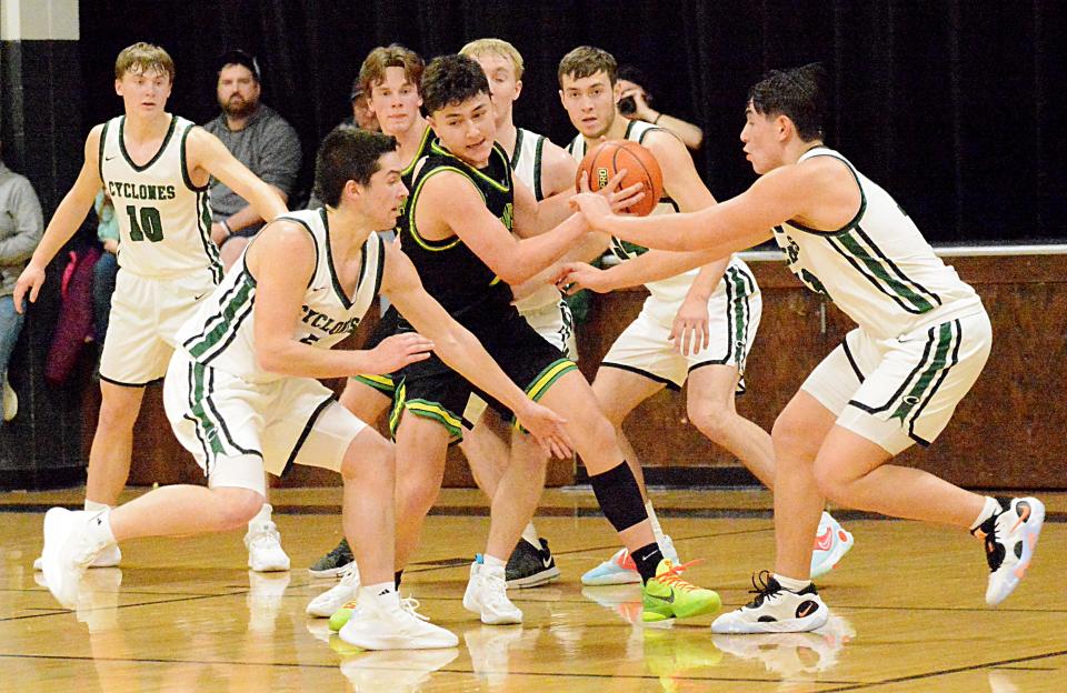 Aberdeen Roncalli's Maddox Miller tries to keep the ball while being guarded by Clark-Willow Lake's Cole Brenden, Trey Huber, Cole Heiman and Kaplan Felberg during their Northeast Conference high school basketball doubleheader on Thursday, Jan. 19, 2023 in Clark. Also pictured at left are Clark-Willow Lake's Tyson Huber and Roncalli's Maddox May.