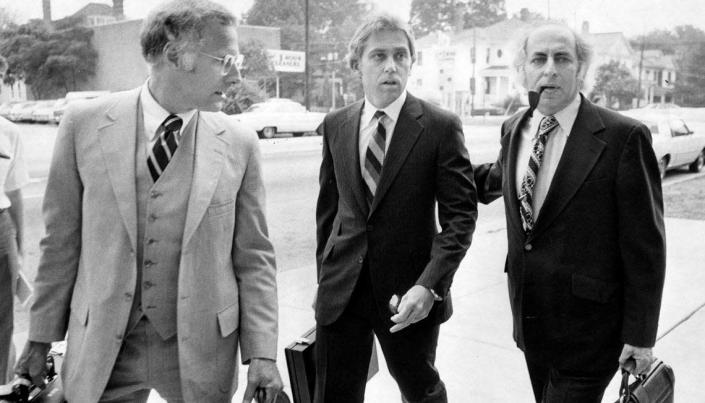 Dr. Jeffrey MacDonald (center) arrives at the US District Court in Raleigh, N.C. flanked by his lawyers Wade Smith (left) and Bernard Segal (right) July 17, 1979.