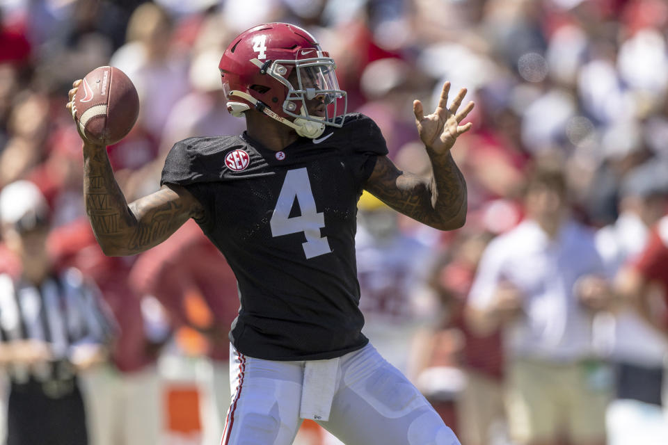 Alabama quarterback Jalen Milroe (4) drops back to throw during the first half of Alabama's A-Day NCAA college football scrimmage, Saturday, April 22, 2023, in Tuscaloosa, Ala. (AP Photo/Vasha Hunt)