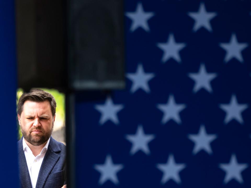 JD Vance waits backstage before speaking during a campaign rally