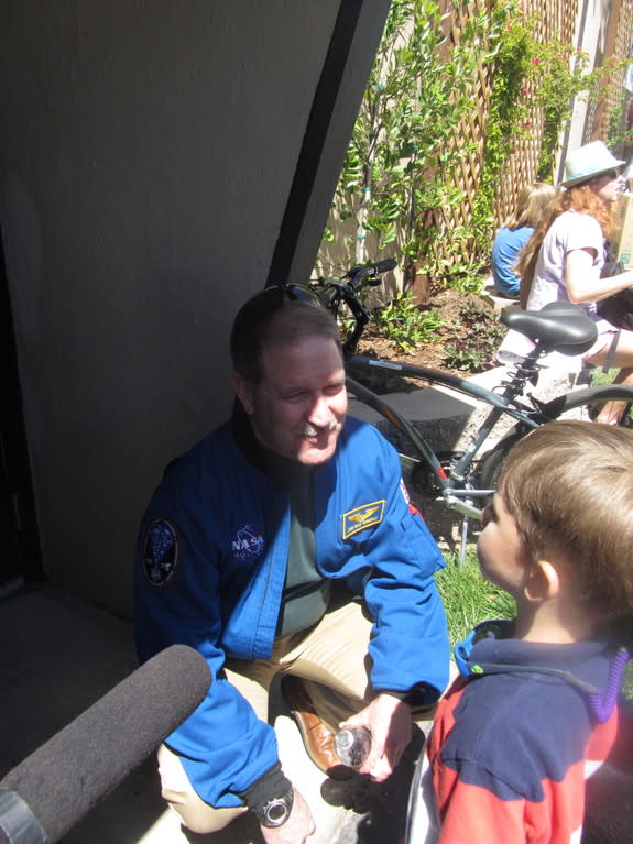 NASA science chief John Grunsfeld talks to an aspiring young space scientist after talking at Maker Faire Bay Area on May 18, 2013.