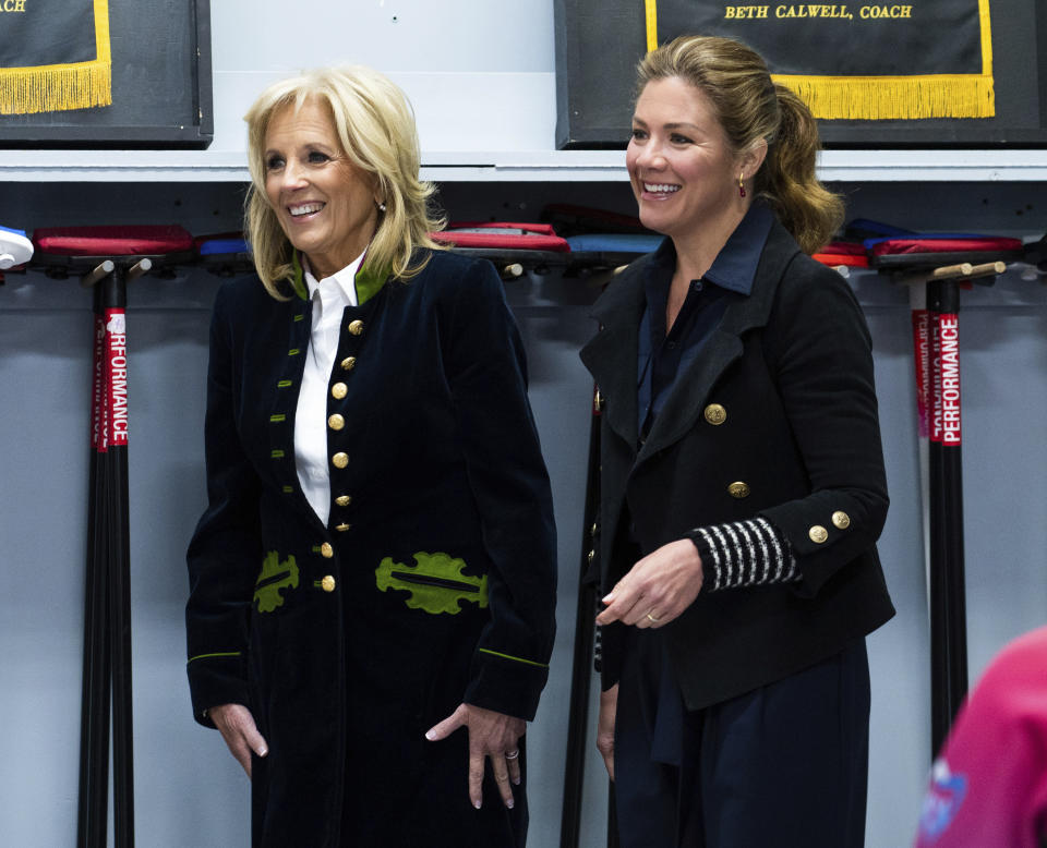 U.S. first lady Jill Biden, and Sophie Gregoire Trudeau speak with youth at the Rideau Curling Club during U.S. President Joe Biden's official trip in Ottawa, Canada, on Friday, March 24, 2023. (Spencer Colby/The Canadian Press via AP)