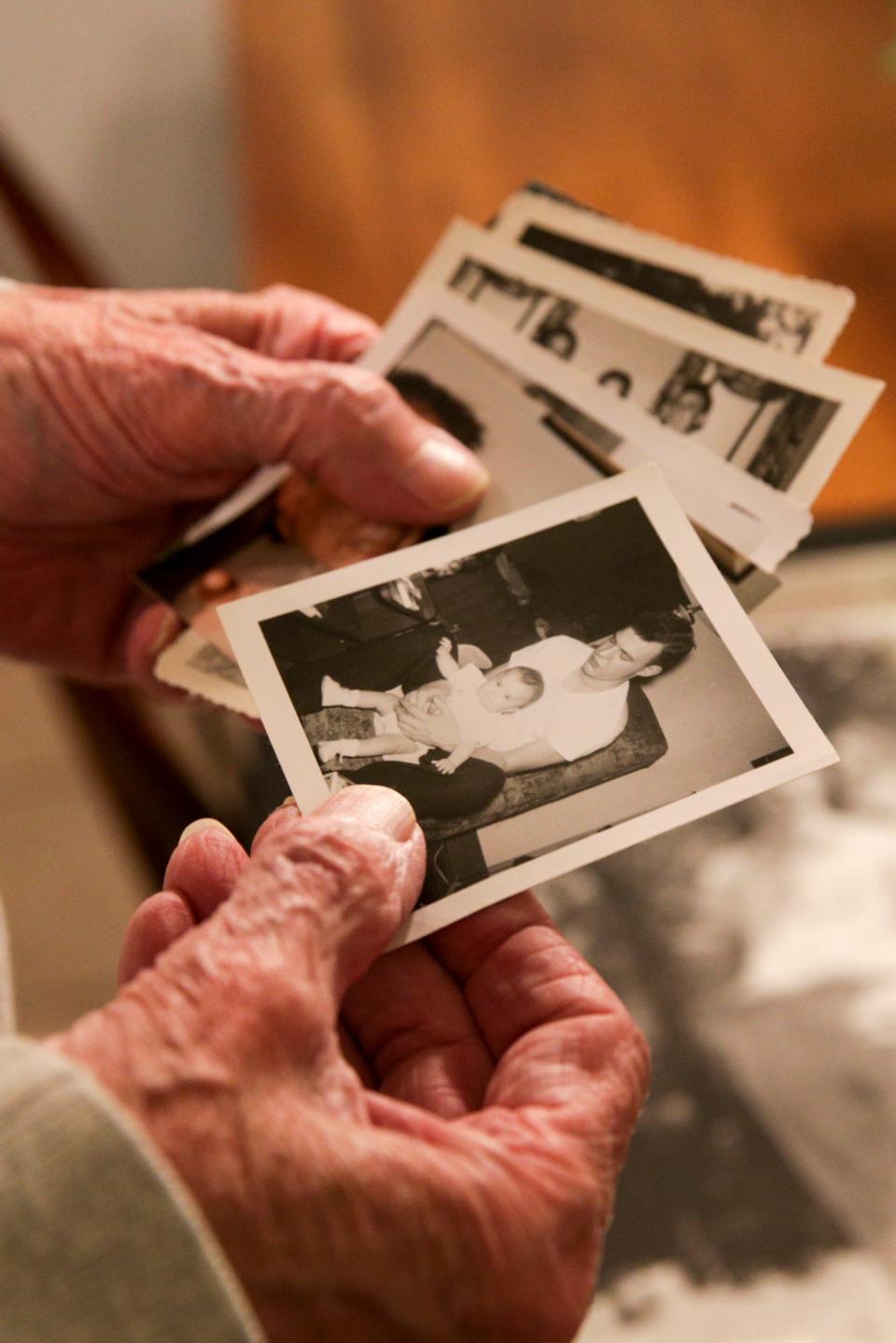 Lon Heide, longtime Lafayette city councilman, leafs through photographs of his family, Thursday, Nov. 18, 2021 in Lafayette.