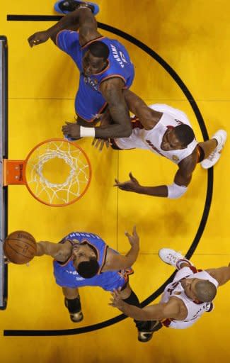 Oklahoma City Thunder Thabo Sefolosha gets off a shot against Miami Heat during the NBA Finals game between the Miami Heat and the Oklahoma City Thunder 17 June, 2012 at the American Airlines Arena in Miami, Florida