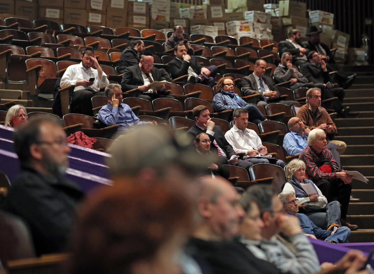 Local residents attend a public meeting where the Chestnut Ridge Board of Trustees will vote on Places of Worship (POW) law at Chestnut Ridge Middle School Feb. 21, 2019. 