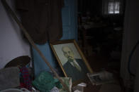 A portrait of Lenin sits on the floor of a house that was occupied by Russian soldiers in Kalynivske, Ukraine, Saturday, Jan. 28, 2023. (AP Photo/Daniel Cole)