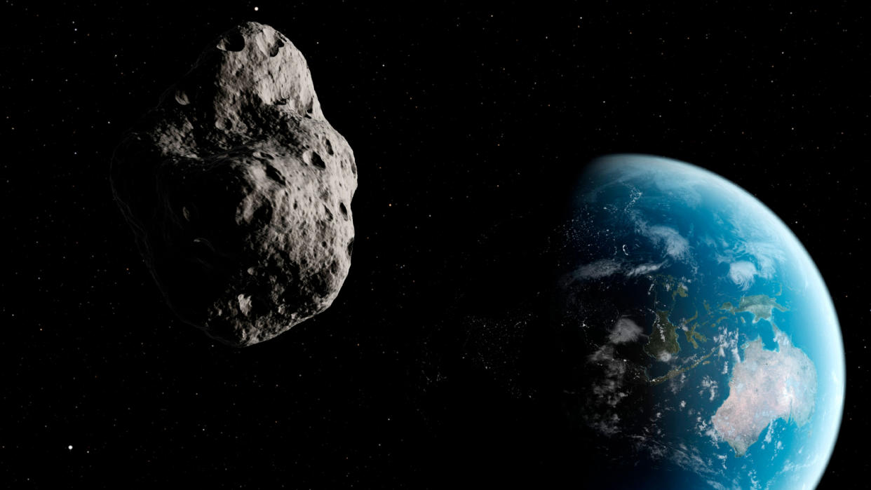  An illustration of an asteroid with Earth in the background. 