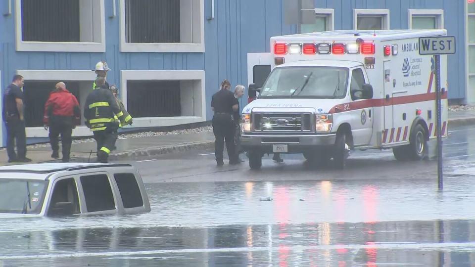 Driver trapped in flood waters on Parker Street in Lawrence