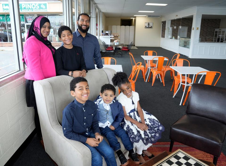 Owners Mohammed Halaoui and Manira Camara pose with their children Hassan, 10, back, and (l-r, front) Gassim, 9, Ali, 2, and Asmah, 6, inside the Le Vieux Lyon French Bakery Cafe's new location at 1792 Brice Rd. which will house a mini-market as well as the tearoom.