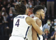 Virginia forward Jayden Gardner, right, celebrates with guard Armaan Franklin (4) after making the winning basket to defeat Pittsburgh in an NCAA college basketball game in Charlottesville, Va., Friday, Dec. 3, 2021. (AP Photo/Andrew Shurtleff)