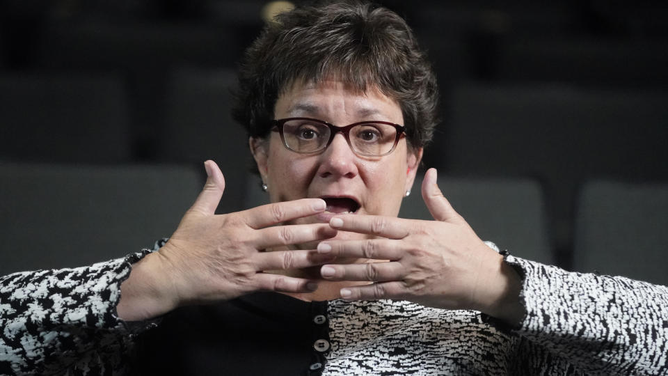 Chelle Wyatt describes how you can't lip read if a person is wearing a mask Friday, April 15, 2022, in Salt Lake City. The COVID pandemic disrupted daily life for people everywhere, but many of those with hearing loss took the resulting isolation especially hard. (AP Photo/Rick Bowmer)