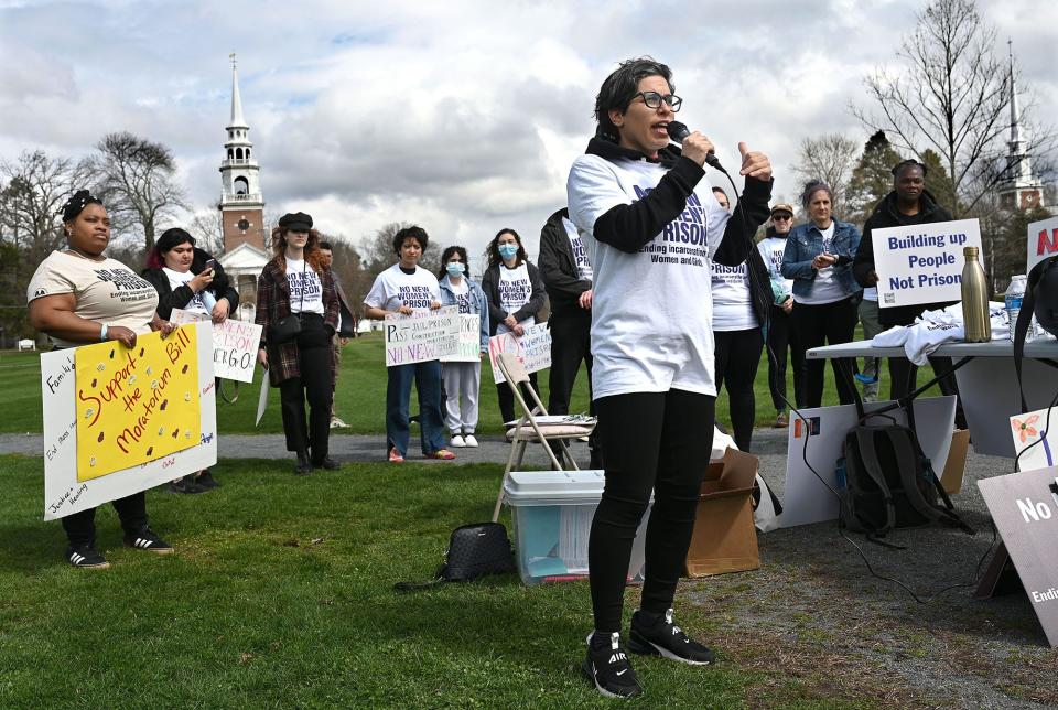 Mallory Hanora of Families for Justice as Healing,  a Roxbury-based advocacy group that aims to end the incarceration of women and girls,  speaks  as supporters of a prison construction moratorium rally on Framingham Centre Common, April 9, 2022. Legislation calling for a moratorium on prison construction would halt the construction and expansion of new prisons for five years.  According to the rally's organizers, the state has proposed a new women’s prison in Norfolk to replace MCI-Framingham. 