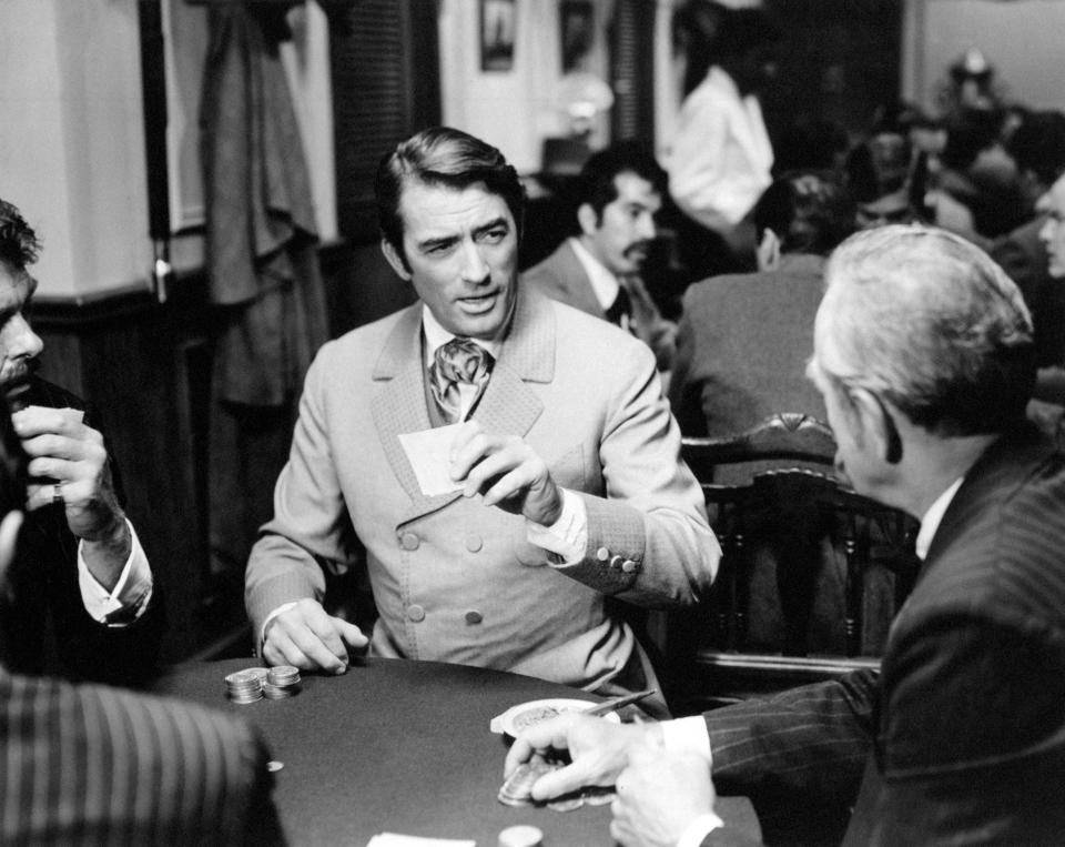 American actor Gregory Peck playing cards in a saloon in the film How the West Was Won. USA, 1962 (Photo by Mondadori via Getty Images)